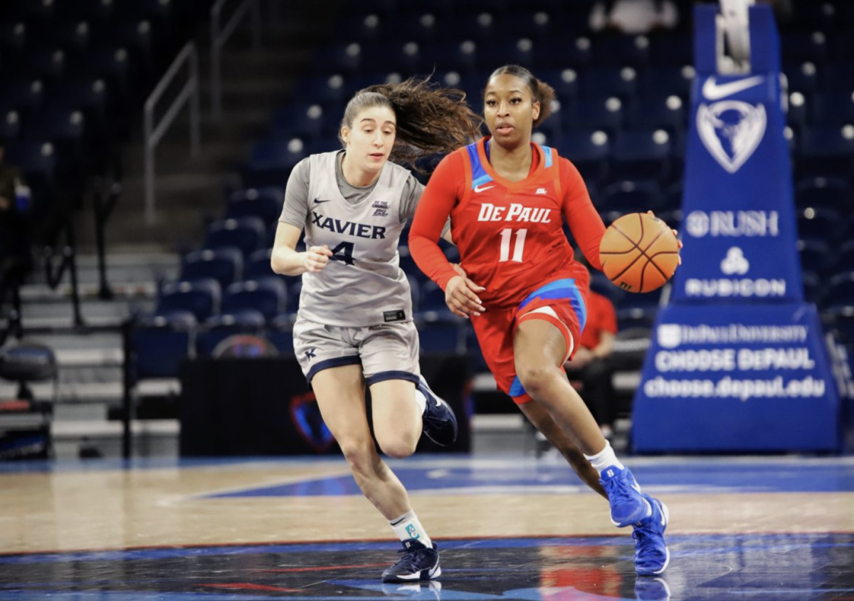 Sumer Lee dribbles down the court while Xavier’s Júlia Garcia Roig follows behind on Wednesday, Jan. 22, 2025, at Wintrust Arena. The DePaul women's basketball team is currently on a two game winning streak.